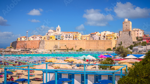 Fototapeta Naklejka Na Ścianę i Meble -  Panoramic view of the old town of Termoli with beach umbrellas, the colorful houses and Svevo Castle, Termoli, Italy