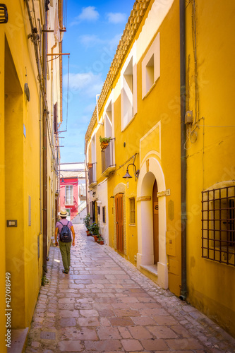 Narrow pedestrian streets in the old town, with colorful houses and cobblestones, Termoli, Italy