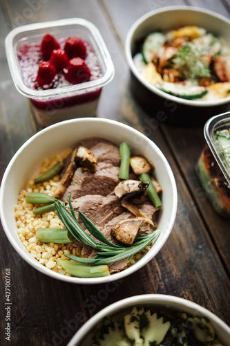 white quinoa with meat and green beans. food delivery, takeaway