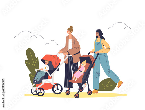 Two mothers walking with babies in strollers in park outdoors. Happy moms pushing kids in pram