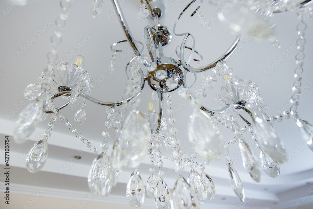 Chandelier decoration in living room. Crystal glass chandelier