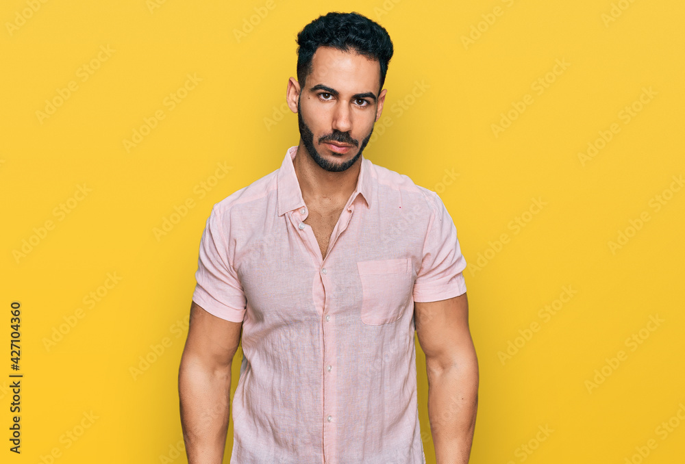 Hispanic man with beard wearing casual shirt depressed and worry for distress, crying angry and afraid. sad expression. Hispanic man with beard wearing casual shirt depressed and worry for distress, crying angry and afraid. sad expression.