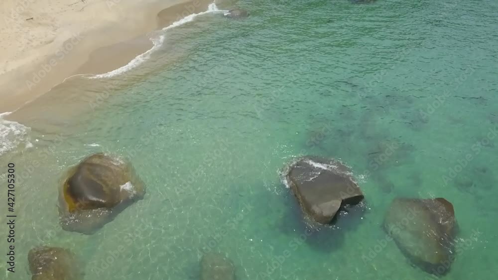 Aerial and slow motion view of a paradisiacal beach in the Angra dos Reis bay, Rio de Janeiro, Brazil Aerial and slow motion view of a paradisiacal beach in the Angra dos Reis bay, Rio de Janeiro, Brazil