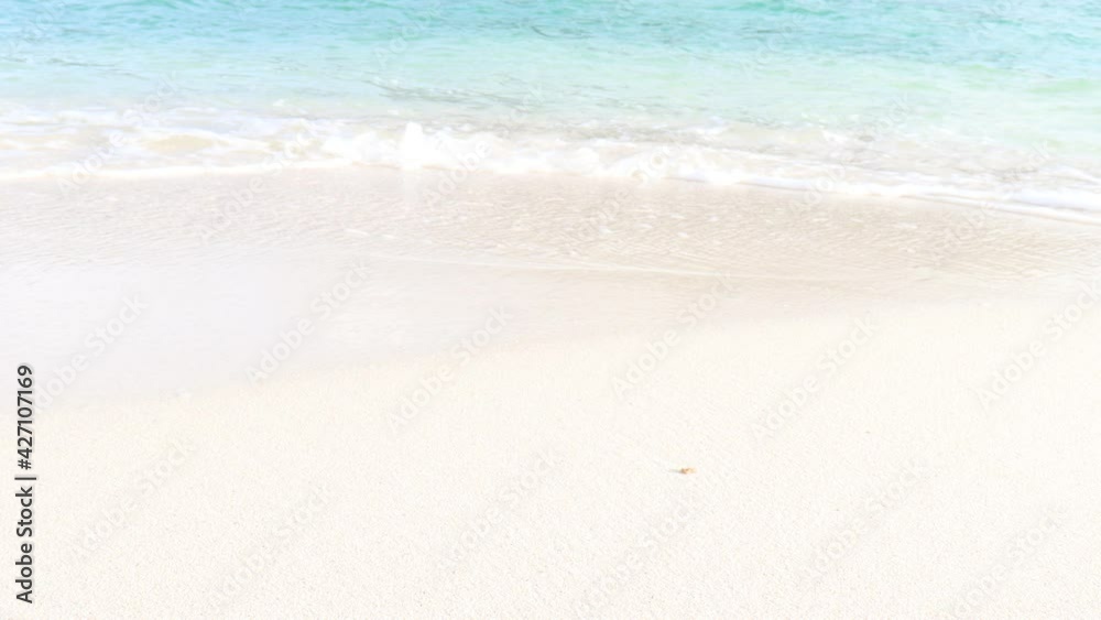 Ocean waves crashing on white sand beach, beautiful natural scene of tropical summer sea beach.