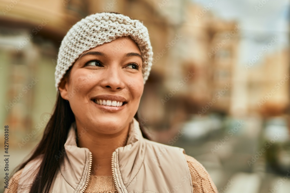 Young latin woman smiling happy standing at the city. Young latin woman smiling happy standing at the city.