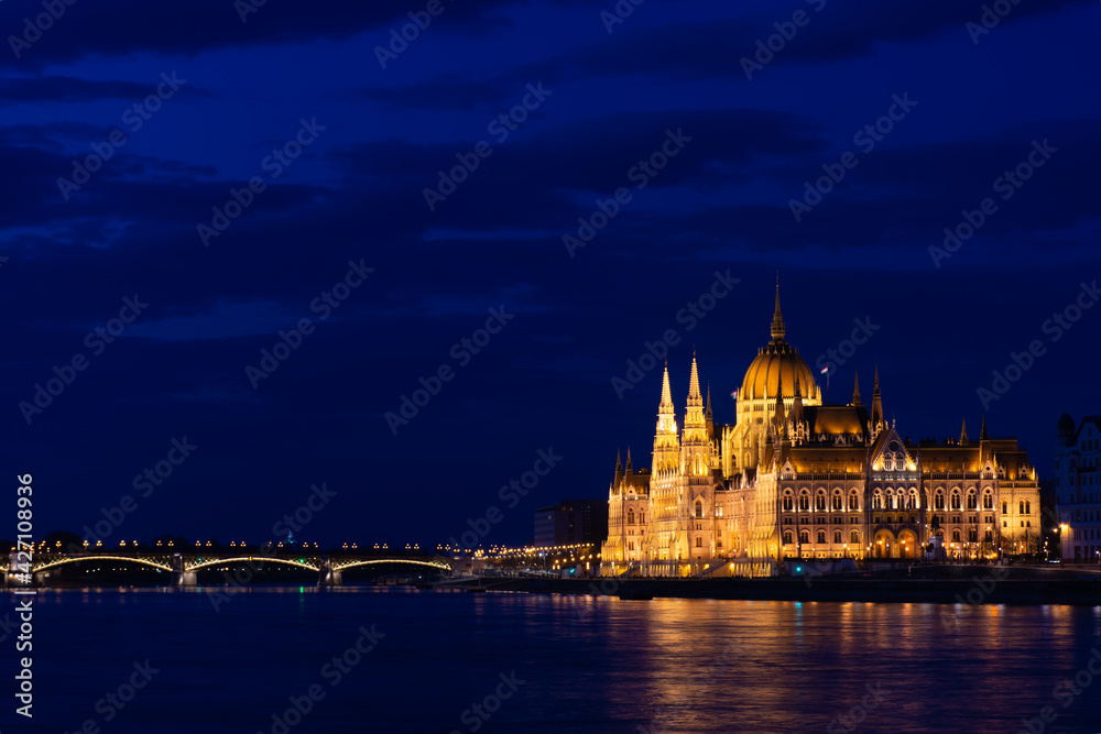 Hungary, Budapest city at night, parliament by the river, reflection of lights in the water