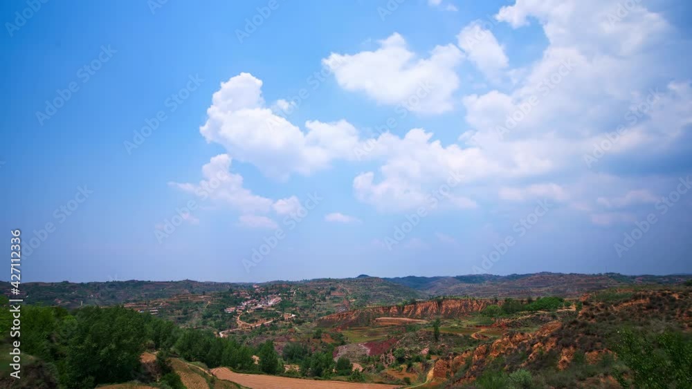 Time-lapse of rolling white clouds in the sky, Chinese mountain countryside landscape Time-lapse of rolling white clouds in the sky, Chinese mountain countryside landscape