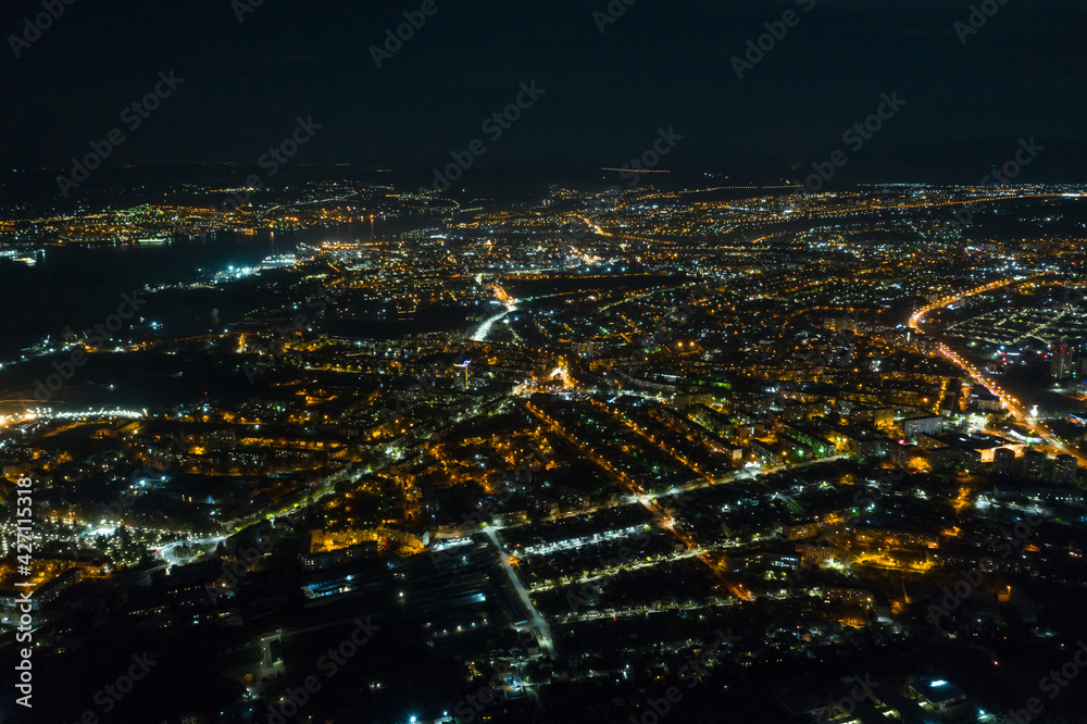 Night Sevastopol glows with lights. City at night from a bird's eye view.