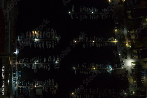 Overnight yacht parking. Night bay of Sevastopol from a bird's eye view. At night, the yachts are parked in the parking lot.