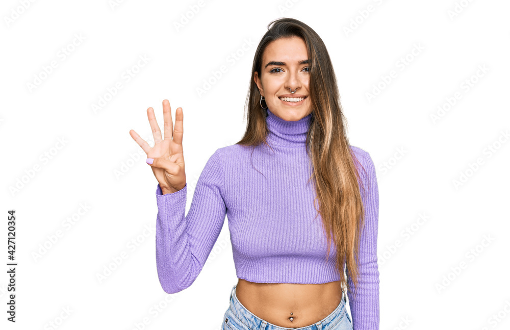 Young hispanic woman wearing casual clothes showing and pointing up with fingers number four while smiling confident and happy. Young hispanic woman wearing casual clothes showing and pointing up with fingers number four while smiling confident and happy.
