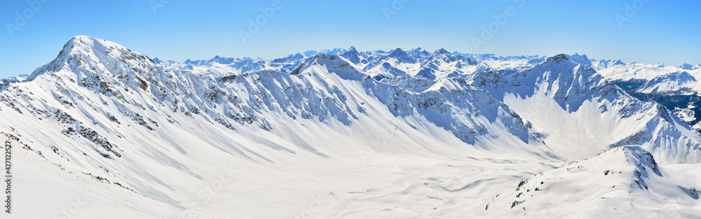 Swiss Alps panorama in Arosa Lenzerheide ski resort, on a sunny Winter day. View from Parpaner Rothorn, Switzerland.