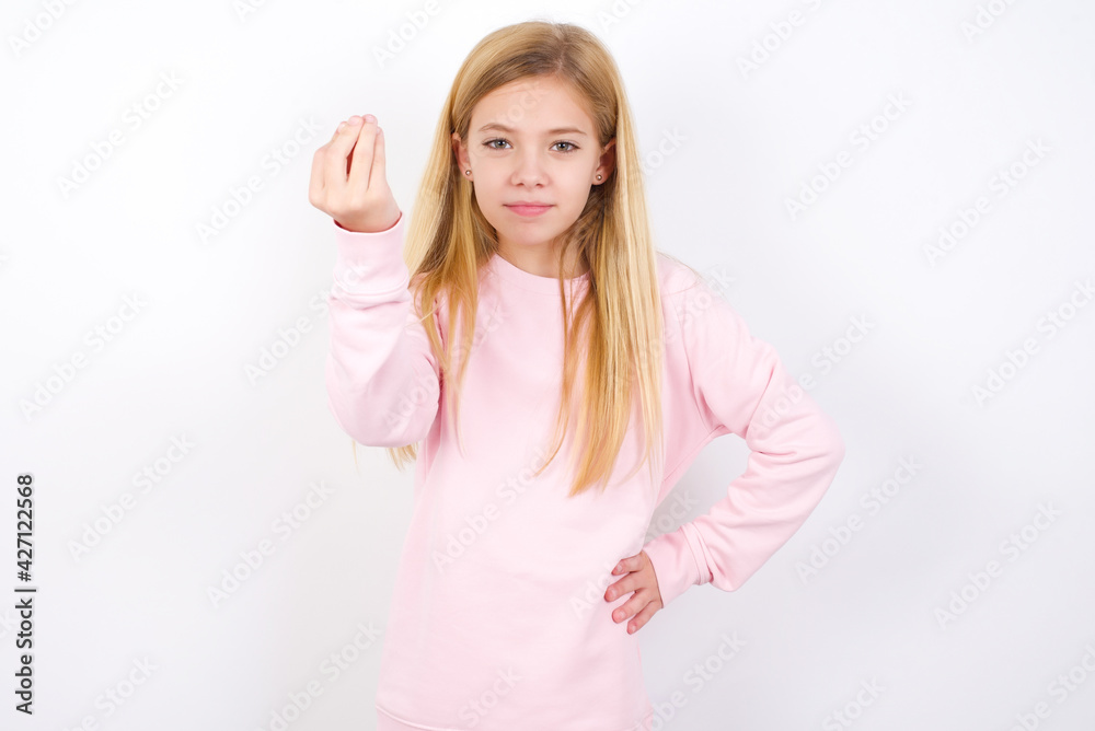 What the hell are you talking about. Shot of frustrated beautiful caucasian little girl gesturing with raised hand doing Italian gesture, frowning, being displeased and confused with dumb question. What the hell are you talking about. Shot of frustrated beautiful caucasian little girl gesturing with raised hand doing Italian gesture, frowning, being displeased and confused with dumb question.