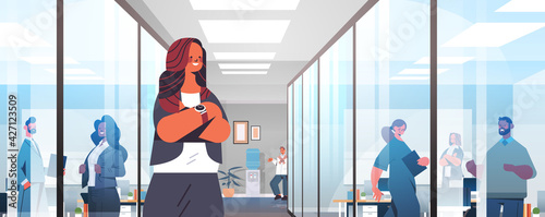 businesswoman leader in formal wear successful business woman standing in corridor leadership concept