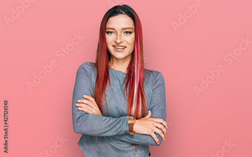 Young caucasian woman wearing casual clothes happy face smiling with crossed arms looking at the camera. positive person. © Krakenimages.com