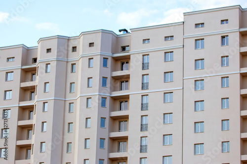 Facade of a new multi-story residential building. architecture and modern construction