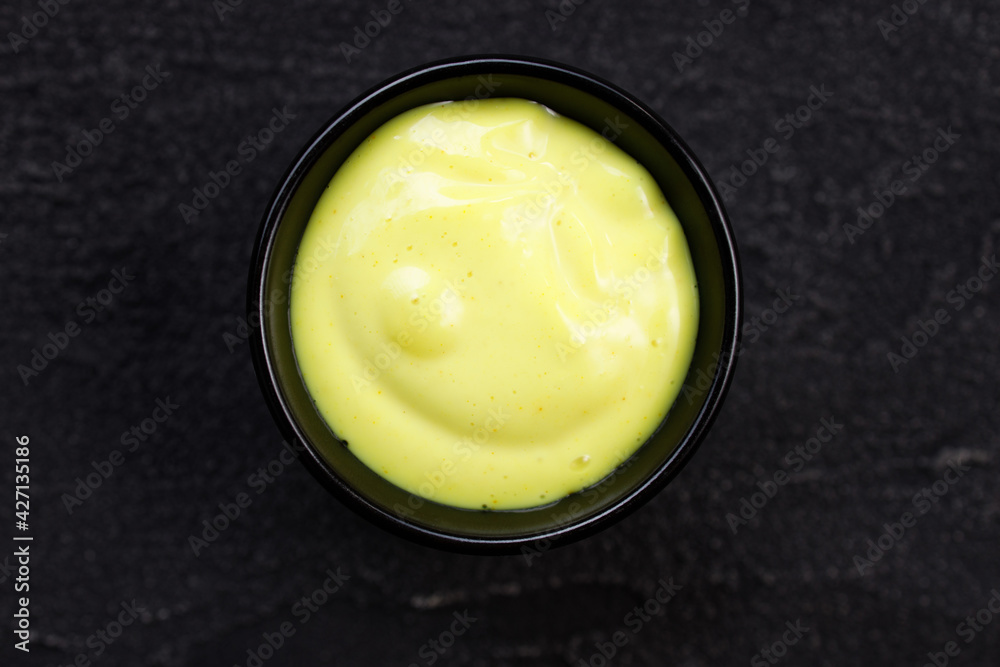 Cheese sauce dip in bowl, condiment for tasty food Cheese sauce dip in bowl, condiment for tasty food