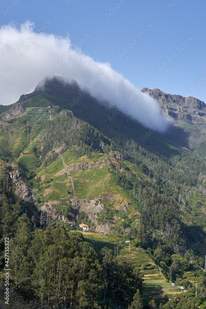  madeira island, mountain peaks with clouds in Serra de Água