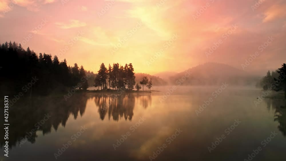 Dramatic sunrise with fog over mountain lake, 4k spectacular video Dramatic sunrise with fog over mountain lake, 4k spectacular video