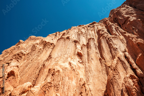 formations of the summit of a red clay mountain in the desert