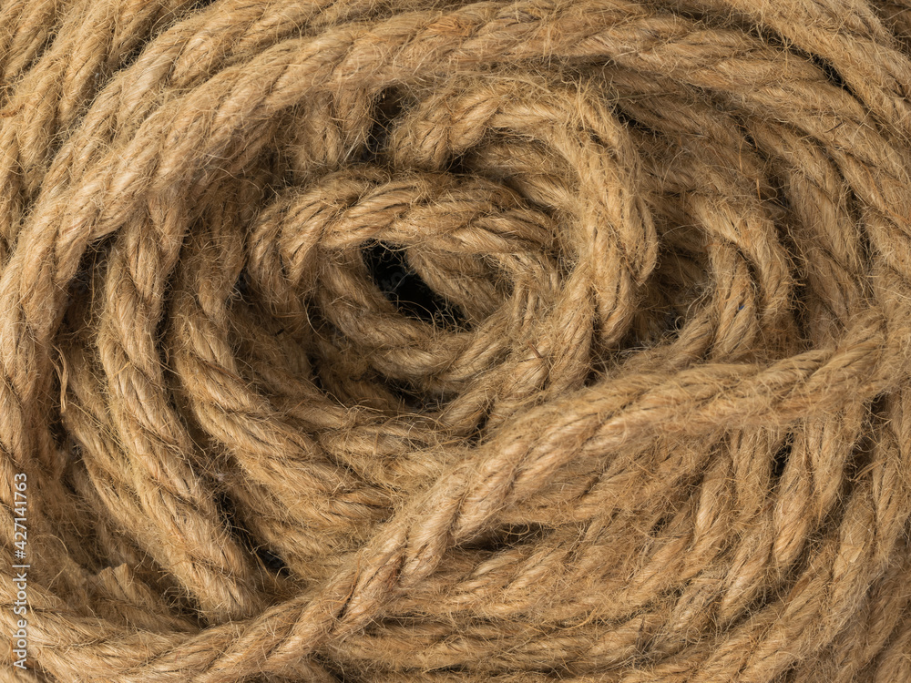 Fototapeta premium The background is made of coiled coarse twisted rope.