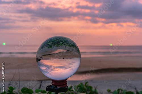 sunset in crystal ball the image that appears in an upside-down looks strange..
