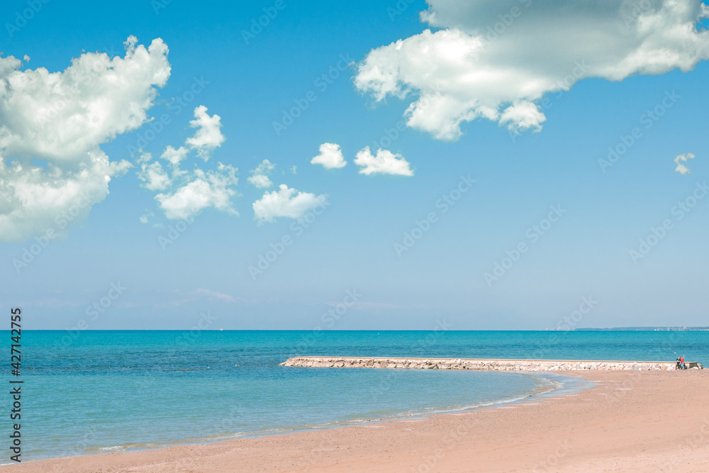 Beautiful landscape with white sand beach. Panoramic view on blue sky and azure coast sea on natural background. Luxury summer vacation Beautiful landscape with white sand beach. Panoramic view on blue sky and azure coast sea on natural background. Luxury summer vacation
