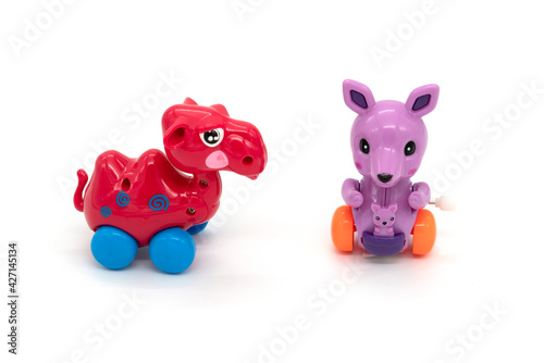 Camel and kangaroo plastic toys, isolated on white background.