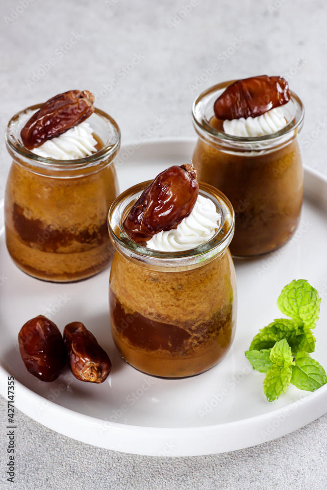 Agar-agar kurma, puding kurma or dates pudding, made of coconut milk, palm sugar and dates. Agar-agar kurma, puding kurma or dates pudding, made of coconut milk, palm sugar and dates.