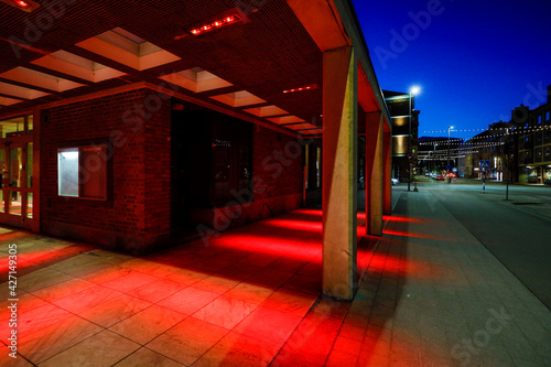 Halmstad, Sweden, A building lit up at night in the color red.