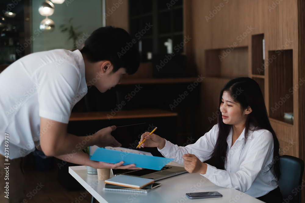 Businessman and team try to explain about his work at home office. Work from home concept. Businessman and team try to explain about his work at home office. Work from home concept.