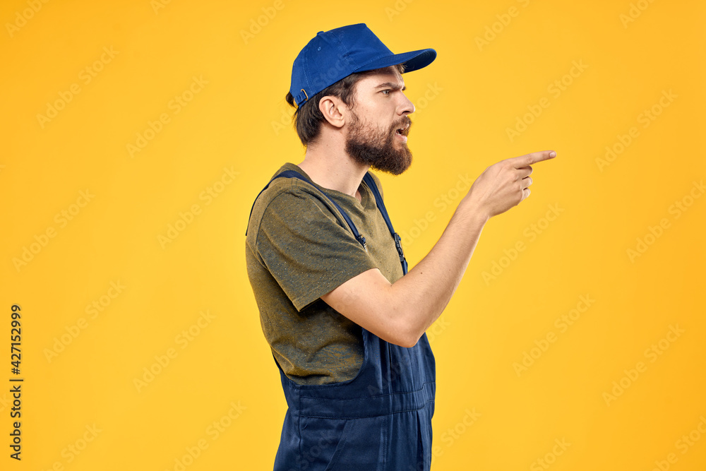 working man in uniform professional delivery service yellow background