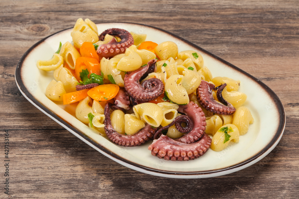 Pasta with octopus and yellow tomatoes Pasta with octopus and yellow tomatoes