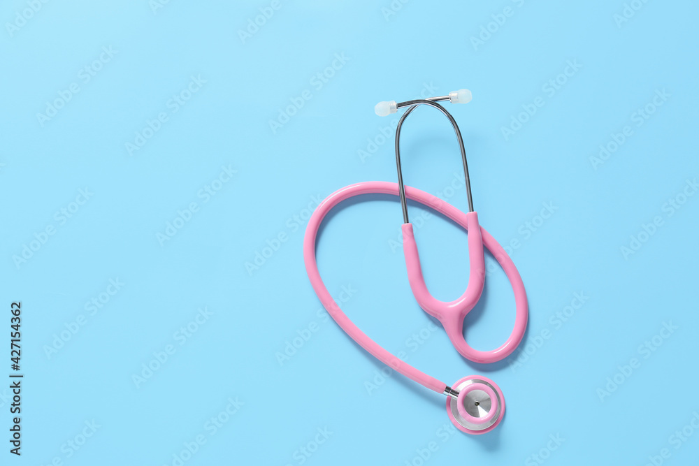 Fototapeta premium Modern stethoscope on color background