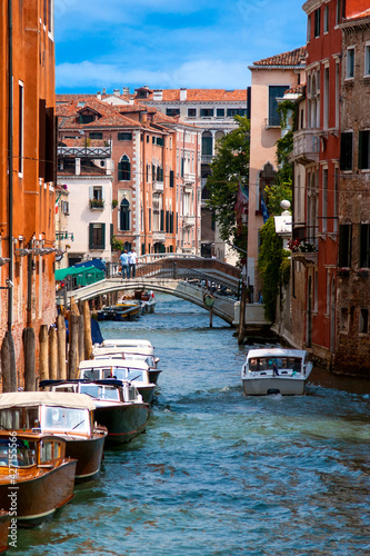 Small canal and view to Ponte dei Greci, Venice, Italy photo