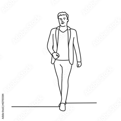 Young man in suit walking. 