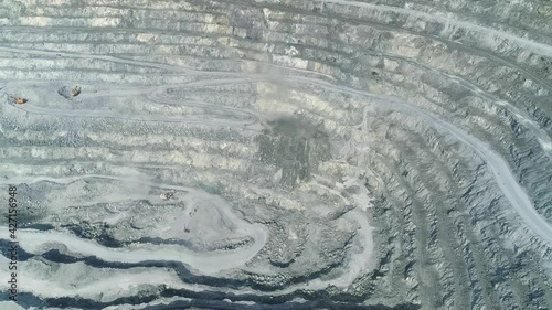 Aerial view of Explosion site in Huge asbestos quarry. Inside the quarry there is a serpentine road for trucks. In the center of the frame is a Explosion site.
