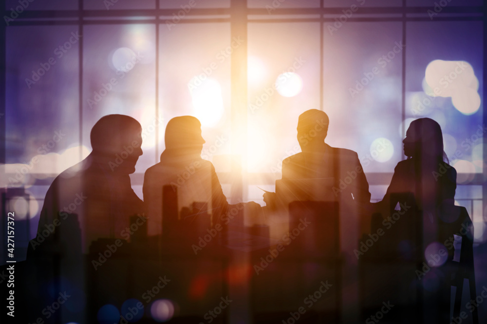 Silhouette of business people discussing in meeting