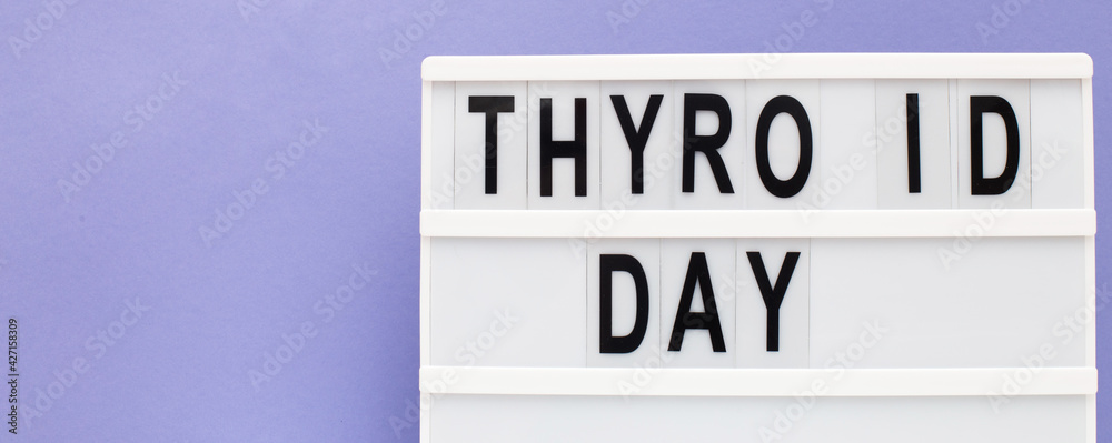 inscription international thyroid day on purple background. copy space. banner inscription international thyroid day on purple background. copy space. banner
