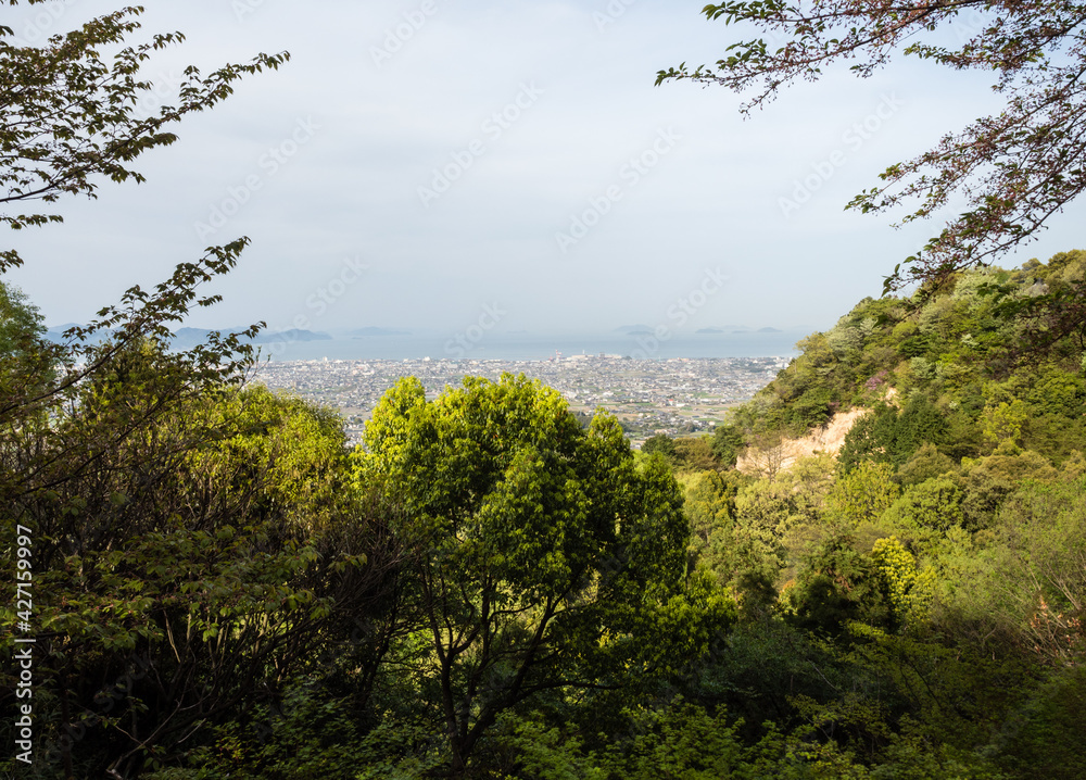 Scenic view of Imabari city and Seto Inland Sea from an overlook near Senyuji, temple number 58 of Shikoku pilgrimage - Ehime prefecture, Japan