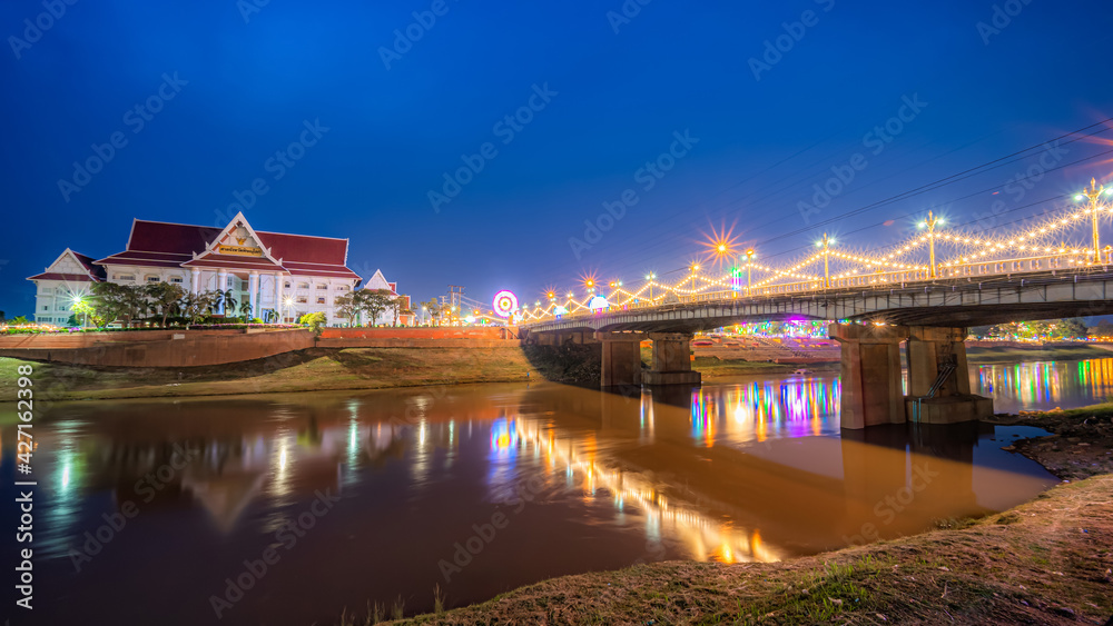 Beautiful light on the Nan River at night on the bridge (Naresuan Bridge) on the Road with court Phitsanulok in Realm for Naresuan the Great Festival and Annual event in Phitsanulok,Thailand.