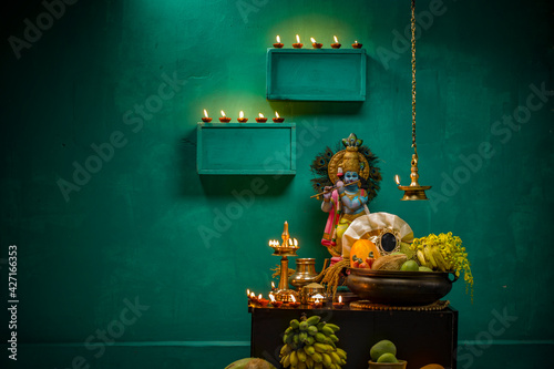 Kerala festival,rituals of Vishu festival -Vishukkani or Vishu sight, a brass vessel  filled with fruits,vegetable, mirror,golden shower flower and new cloth arranged  traditionally