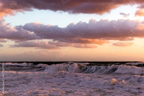 Cloudy sunset at the stormy sea. © Sergey Fedoskin