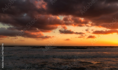 Cloudy sunset at the stormy sea. © Sergey Fedoskin