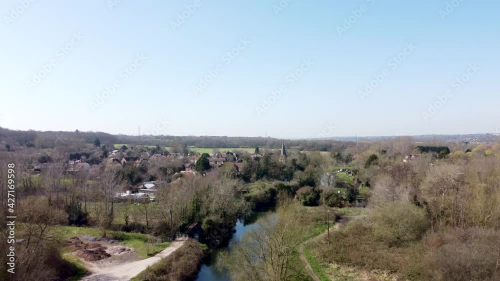 Drone flies straight up over the River Great Stour. Behind the trees lies the small village of Fordwich, England Drone flies straight up over the River Great Stour. Behind the trees lies the small village of Fordwich, England