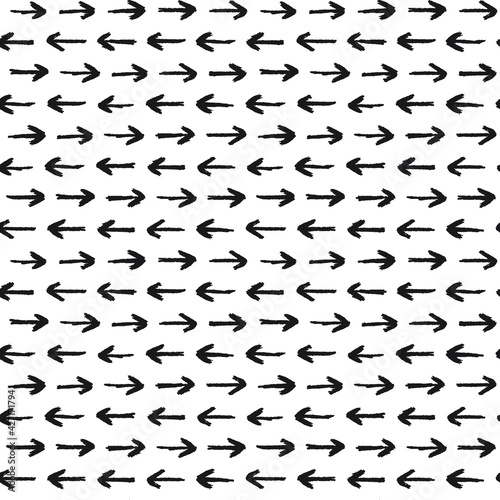 Seamless pattern with arrows in opposite directions. A seamless pattern made with hand drawn arrows.