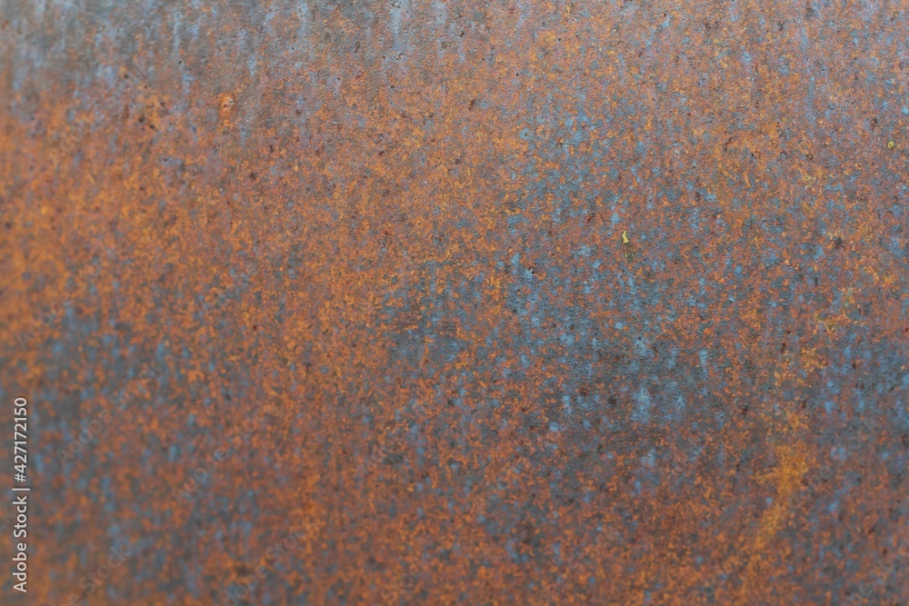 Closeup of Surface peeling old car paint cracked with rusty background