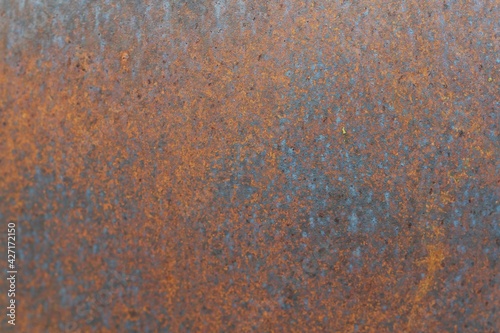 Closeup of Surface peeling old car paint cracked with rusty background © korrakot sittivash