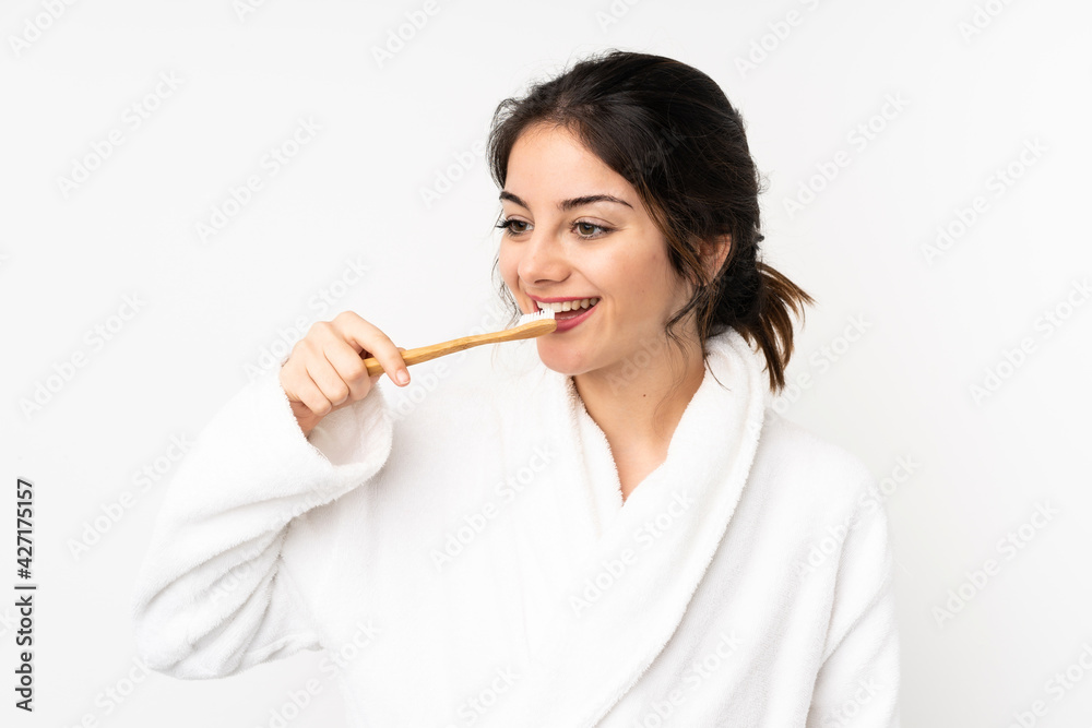 Young caucasian woman isolated on white background with a toothbrush Young caucasian woman isolated on white background with a toothbrush