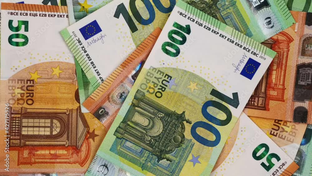 Euro cash banknotes background. Top view of rotating different Euro bills. European money. Top view. 4k video Euro cash banknotes background. Top view of rotating different Euro bills. European money. Top view. 4k video