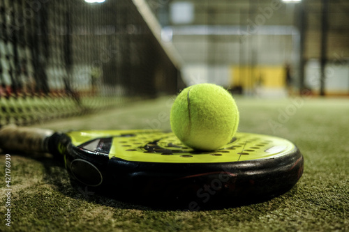 Paddle tennis balls on racket in court © FotoAndalucia